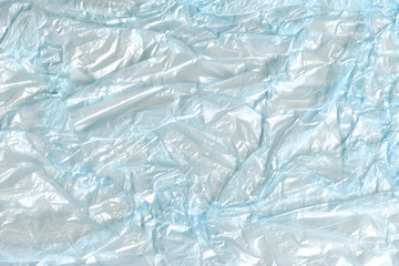 Blue transparent crumpled plastic packing texture background