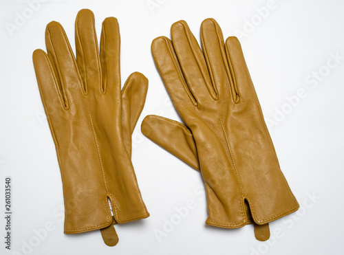 Photographie brown glaves isolated in white background, fashion gloves,leather
