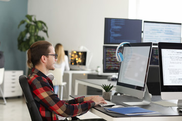 Male programmer working in office