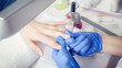 Finger nail treatment, grinding and polishing in beauty salon