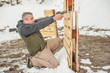 Instructor demonstrate body position of gun shooting from behind barricade