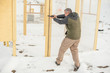 Instructor demonstrate body position of gun shooting from behind barricade