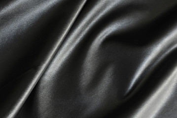 Shiny, silky and smooth surface of black fabric background