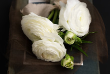 Up Close Of A Bouquet Of White Flowers On A Dark Background