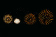 © Yakov Knyazev/Stocksy - Several fireworks burst In the night sky with long traces