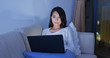 © leungchopan - Woman study on laptop at home in the evening
