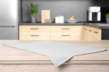 Napkin On Wooden Table In Kitchen. Mockup For Design