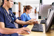 © Per Swantesson/Stocksy - Young doctors using tablets and computers
