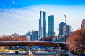 Bridge over road and Chicago skyscraper skyline