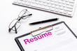 © 9dreamstudio - Review resumes of applicants set with keyboard and glasses white work desk background