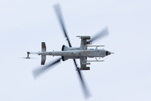 Unusual Bottom View Of A AH-1 Viper Attack Helicopter, With Rockets And Machine Gun