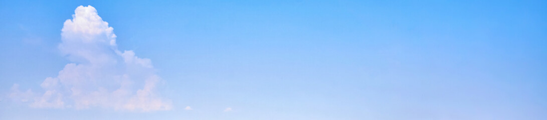 Background of the light blue sky with a white cloud. panorama