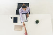 © InfiniteFlow - Two young business women in meeting at office table for job application and business agreement. Recruitment and human resources concept.