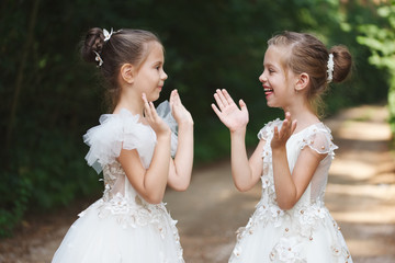 happy beautiful girls with white wedding dresses