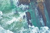 Fototapeta Morze - Aerial view to ocean waves. Blue water background. Photo made from above by drone.