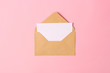 © White bear studio  - envelope on a colored background top view.