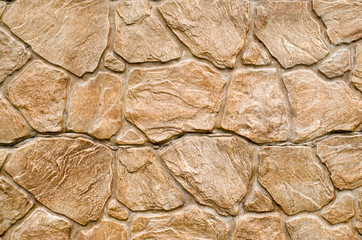 New brown cladding tiles imitating stones on wall