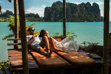 loving couple resting in asia. a young couple travels to exotic countries. man and woman at the reso