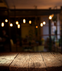 blurred background of bar and dark brown desk space of retro wood