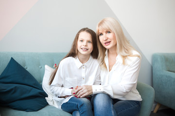 portrait of smiling mother and daughter  are spending time together.