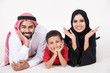 © Mahmoud Rahall - Arab family lying down on the floor smiling