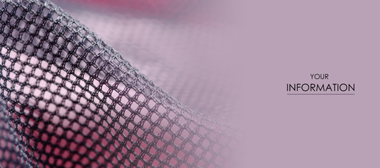 Black mesh lining fabric textile material cloth macro pattern on blur background