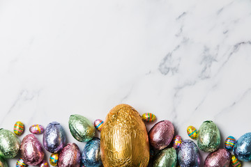 Wall Mural - Easter egg chocolate treats wrapped in shiny coloured foil