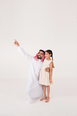 Canvas Print - Arab father with his daoghter showing her something