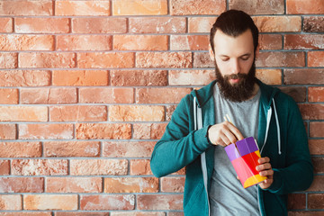 Wall Mural - Millennials business world. IT worker with tight agenda eating takeaway meal from box. Fast food as desperate solution.