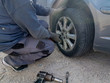 © sea and sun - car flat tire change replace on the road problem emergency