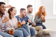 © Prostock-studio - Cheering for favourite team. Friends watching match