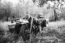 Old Tricar, Three-Wheeled Motorbike Of Wehrmacht, Armed Forces Of Germany Of World War II Time In Summer Forest. Photo In Black And White Colors