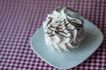 White meringue with chocolate stripes.