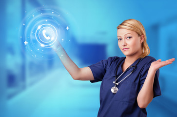 Wall Mural - Doctor touching blue screen with call center concept
