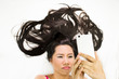© Nutt - Closeup portrait of moody asian women  lying on ground with black long hair. acting upset , unhappy,