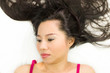 © Nutt - Closeup portrait of moody asian women  lying on ground with black long hair. acting upset , unhappy,