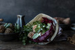 © Olga Vila/ADDICTIVE STOCK - From above tasty sweet potato falafel with parsley and cabbage on plate near vegetables on wooden board