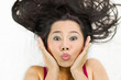 © Nutt - Closeup portrait of happy asian women  lying on ground with black long hair. acting smile, fun,