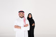 © Mahmoud Rahall - arab couple smiling and standing on white background