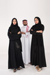 © Mahmoud Rahall - Two arab females with one male smiling and standing on white background