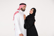© Mahmoud Rahall - Arab couple standing on white background