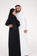 © Mahmoud Rahall - Arab couple standing on white background