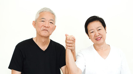Wall Mural - Asian senior couple hold hand happy marriage together expression white background