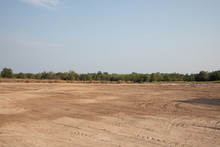 Empty Dirt Field On Sunny Day At Thailand
