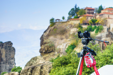 Camera on tripod and Meteora monasteries