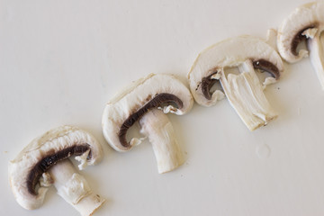 Champignon mushrooms fresh raw vegetarian food on table white background