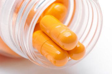 beautiful orange capsules with bottle, medicines for health