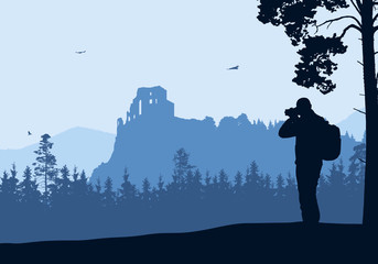 Wall Mural - Realistic illustration with silhouette of old castle ruins in mountain landscape with forest. Tourist with backpack takes pictures by camera. Blue sky with birds - Vector
