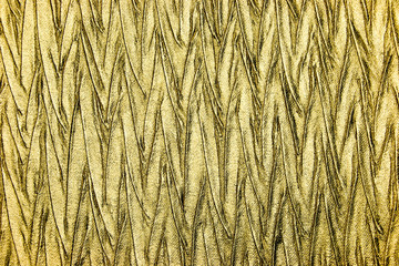Abstract textured background of luxury gold fabric 
