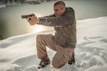 Wall Mural - Instructor demonstrate body position of gun shooting on shooting range